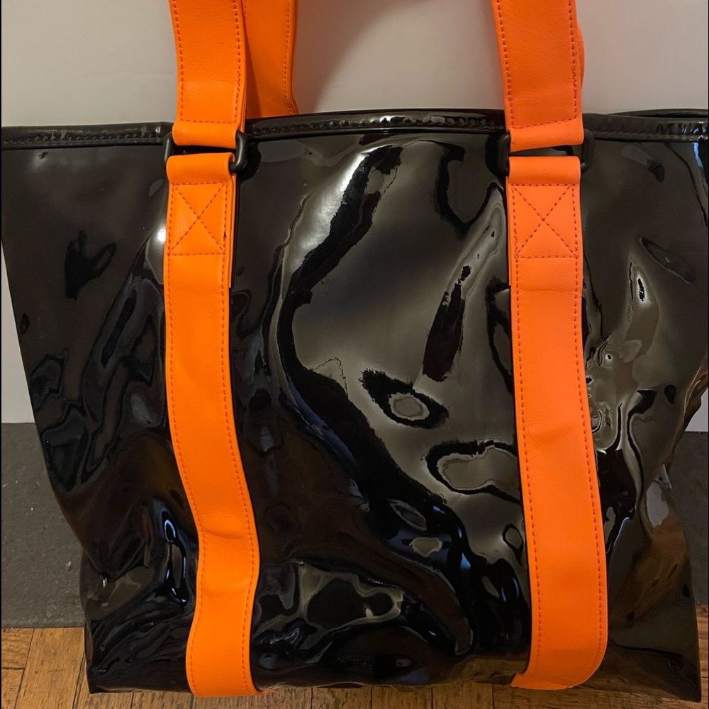 Marc By Marc Jacobs black patent leather shopper.  Neon Orange shoulder straps.